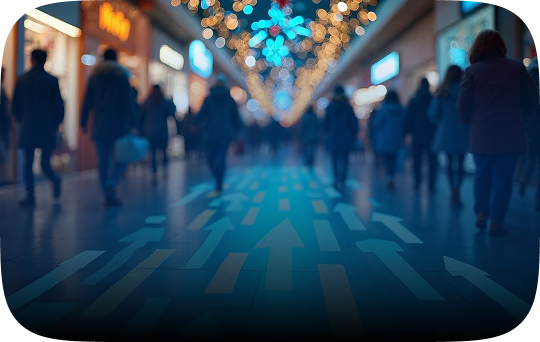 People walk along a street with colorful arrows guiding their paths.